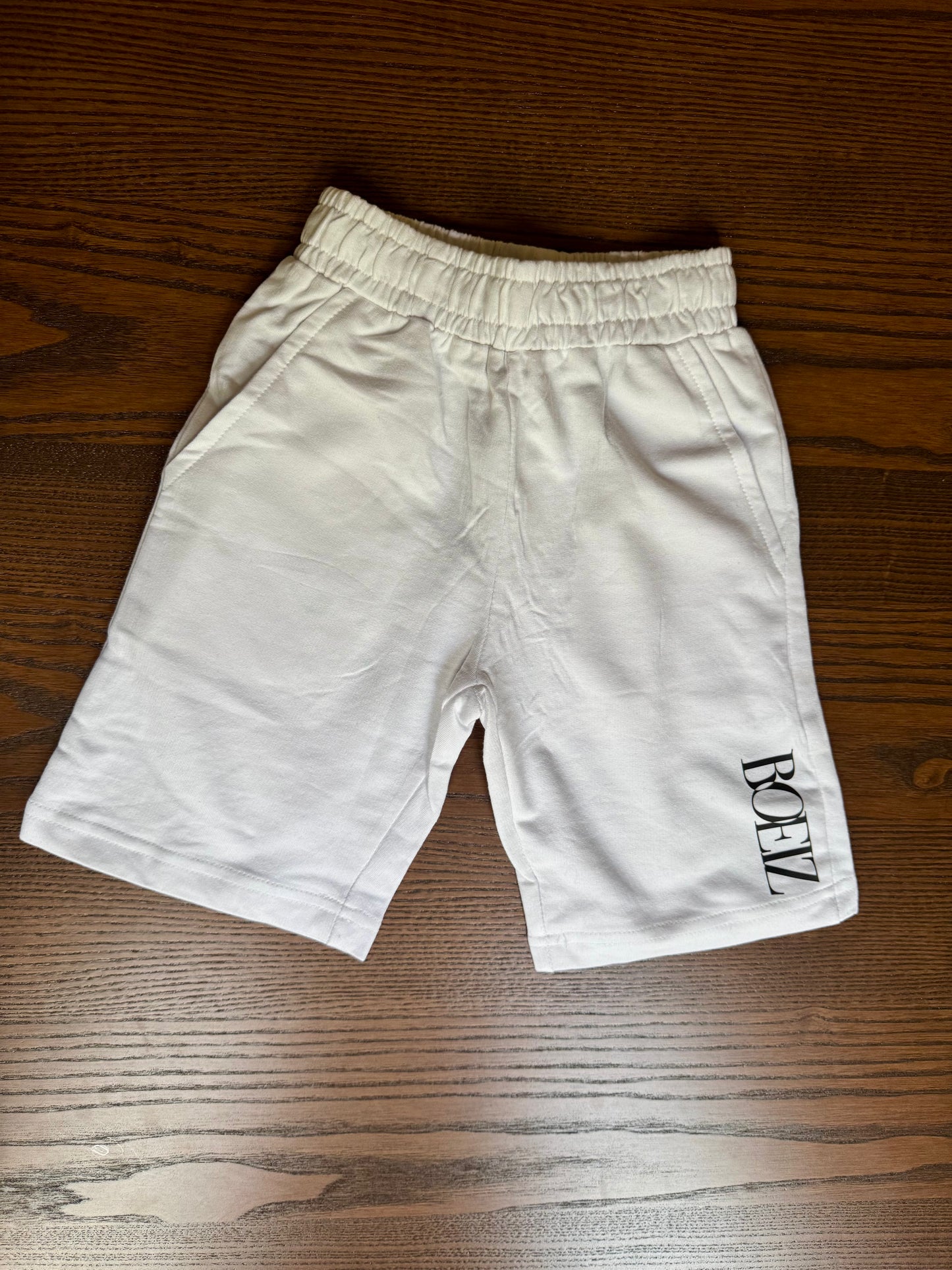 White shorts with a logo 100% cotton  