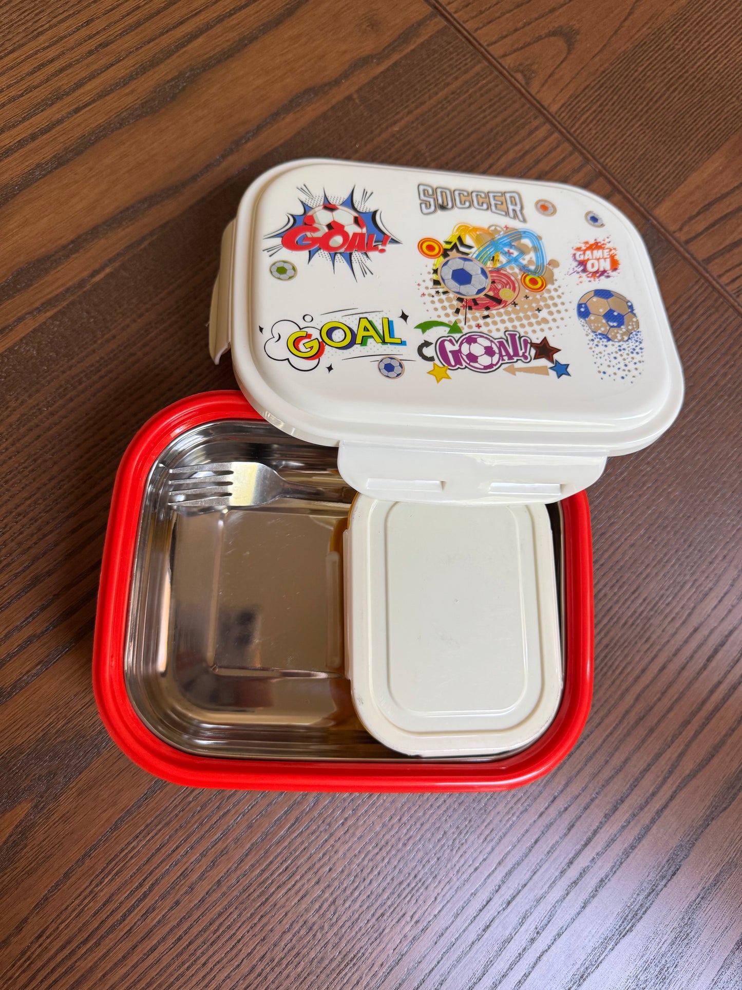 Red and white food container with colorful stickers   Insulated Football Lunch Box – 700ml with Mini Steel Dibbi & Fork